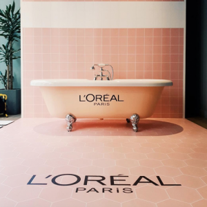 Floor coverings in pink hexagonal tile pattern, pink bath, pink square wall tiles