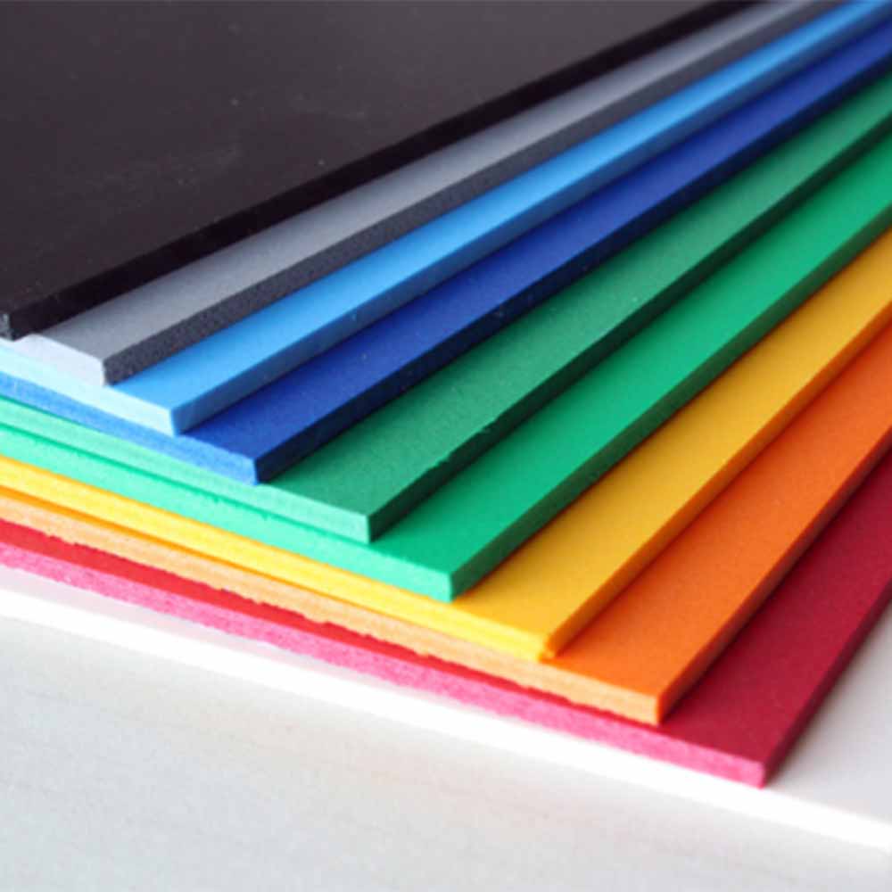 Coloured pvc foam board panels stacked in a spectrum arrangement