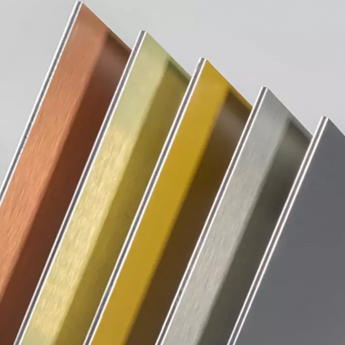 Brushed metallic bronze, gold and silver aluminium composite panels in a diagonal row