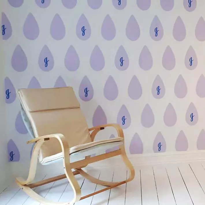 Promotional branded temporary wallcovering with lilac coloured tear shapes in a teselating pattern